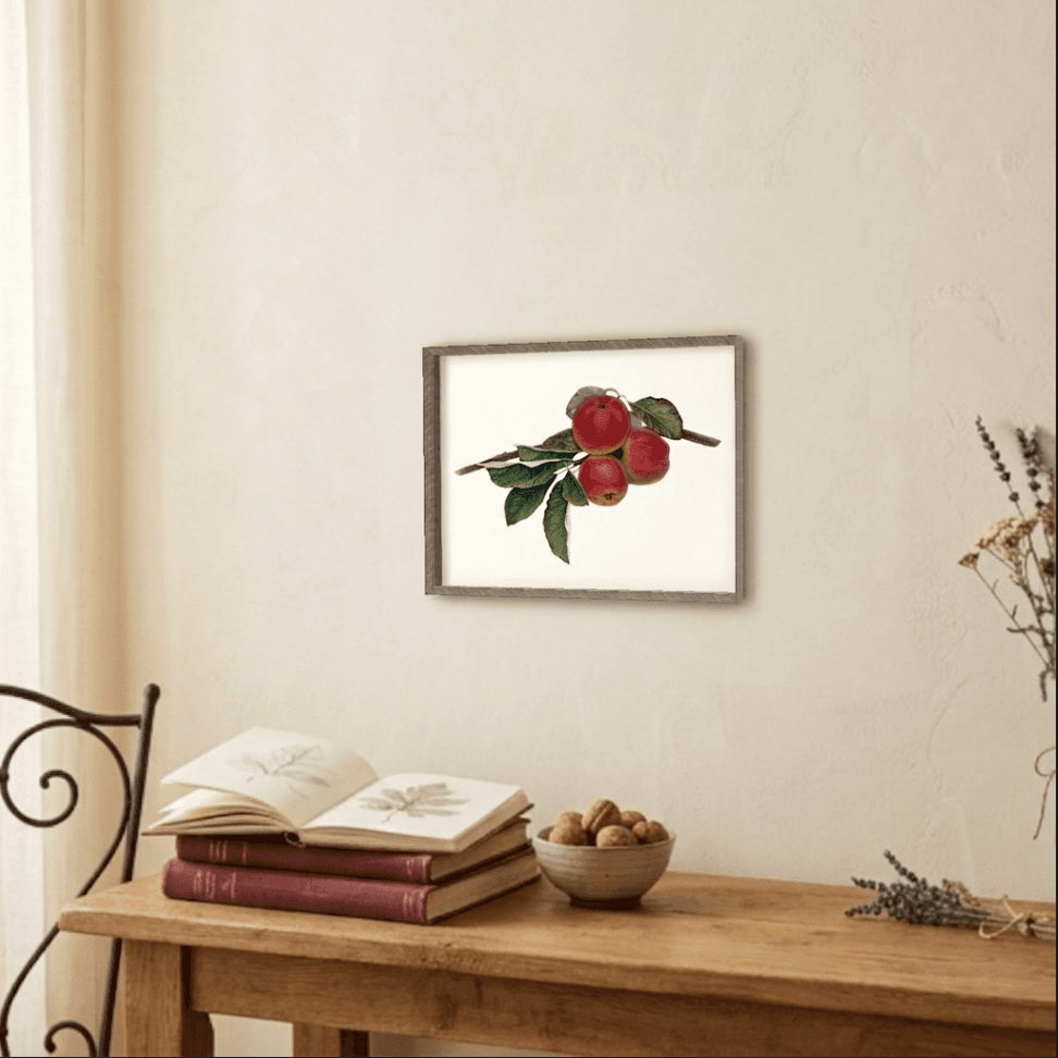 Harvest Moment framed on a pale wall above a wooden console with books and a bowl